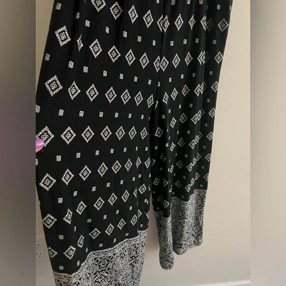 Torrid Super Soft Black Border Print Smocked
Culotte Jumpsuit Size 0 - Picture 4 of 7